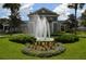 Beautiful apartment complex exterior with landscaping and fountain at 3176 Feltrim Pl # 302, Kissimmee, FL 34747
