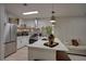 Modern kitchen with stainless steel appliances and sleek countertops at 3176 Feltrim Pl # 302, Kissimmee, FL 34747
