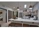 Open concept kitchen with center island, stainless steel appliances and natural lighting at 3176 Feltrim Pl # 302, Kissimmee, FL 34747