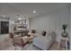 Cozy living room with kitchen, comfortable seating and natural lighting at 3176 Feltrim Pl # 302, Kissimmee, FL 34747