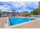 Beautiful community pool area with ample seating and a clubhouse for leisure and entertainment at 3176 Feltrim Pl # 302, Kissimmee, FL 34747