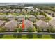 Aerial shot of a townhouse highlighting its prime location in a desirable, well-maintained community at 3537 Seneca Club Loop # B, Orlando, FL 32808