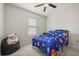 Bedroom features a window, bed with blue space-themed bedding, and Star Wars decor at 3537 Seneca Club Loop # B, Orlando, FL 32808