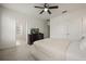 Bedroom featuring carpet, ceiling fan, dresser with television, and a bed at 3537 Seneca Club Loop # B, Orlando, FL 32808