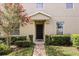 Charming townhome entrance with manicured landscaping and a welcoming front door at 3537 Seneca Club Loop # B, Orlando, FL 32808