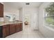 Open kitchen view featuring connecting views to dining and living room areas of the townhome at 3537 Seneca Club Loop # B, Orlando, FL 32808