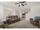 Spacious living room features neutral carpet, and an open layout to the dining and kitchen area at 3537 Seneca Club Loop # B, Orlando, FL 32808