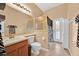 Bathroom with tiled floors, a glass-enclosed shower, sink with vanity and door to backyard at 3954 Old Dunn Rd, Apopka, FL 32712