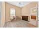 Spacious bedroom with wood flooring and an adjoining bathroom entrance. Natural light and ample storage solutions at 3954 Old Dunn Rd, Apopka, FL 32712