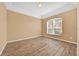 Well-lit bedroom showcasing wood flooring and a bright window, creating a serene atmosphere at 3954 Old Dunn Rd, Apopka, FL 32712