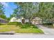 Charming single-story home with lush landscaping and a well-manicured front yard at 3954 Old Dunn Rd, Apopka, FL 32712