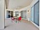 Covered patio featuring a ceiling fan and sliding doors leading to the interior at 3954 Old Dunn Rd, Apopka, FL 32712