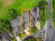 Beautiful aerial view of a well-maintained home with lush landscaping and mature trees near a street at 3966 Villas Green, Longwood, FL 32779