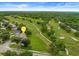 A stunning aerial view of the property located on a verdant golf course at 3966 Villas Green, Longwood, FL 32779