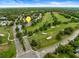 This aerial view showcases the home nestled along a picturesque golf course at 3966 Villas Green, Longwood, FL 32779