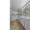 Bathroom features a white vanity, tile floors, and a shower-tub combination at 3966 Villas Green, Longwood, FL 32779