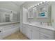 Bathroom features double sinks, a vanity, built in storage, tile floors and shower-tub combo at 3966 Villas Green, Longwood, FL 32779