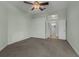 Bright and airy bedroom with soft carpet, ceiling fan and ensuite bath at 3966 Villas Green, Longwood, FL 32779