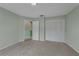 Cozy bedroom with closet and an open doorway to another room at 3966 Villas Green, Longwood, FL 32779