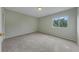 Bedroom featuring neutral carpeting and a window for natural light at 3966 Villas Green, Longwood, FL 32779