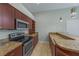 Modern kitchen with granite countertops, stainless steel appliances, and tile flooring at 3966 Villas Green, Longwood, FL 32779