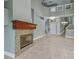 Spacious living room boasts a stone fireplace and neutral color palette, with tile flooring throughout at 3966 Villas Green, Longwood, FL 32779
