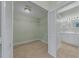 Large walk-in closet featuring wire shelving, tile floors, and access to the main bath at 3966 Villas Green, Longwood, FL 32779