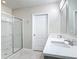 Bathroom featuring a walk-in shower with sliding glass doors, double sink vanity and modern fixtures at 3975 Silverstream Ter, Sanford, FL 32771