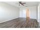 Bedroom featuring hardwood floors, bright natural light, and a glimpse into the adjoining bathroom at 3975 Silverstream Ter, Sanford, FL 32771