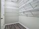 Walk-in closet featuring wood-style floors and wire shelving offering great storage solutions at 3975 Silverstream Ter, Sanford, FL 32771