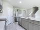 Spacious kitchen featuring a center island, stainless steel refrigerator, and ample cabinet space at 3975 Silverstream Ter, Sanford, FL 32771