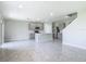 Bright open-concept kitchen featuring stainless steel appliances and a center island with a sink at 3975 Silverstream Ter, Sanford, FL 32771