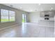 Open-concept living room featuring tile floors, and sliding glass door at 3975 Silverstream Ter, Sanford, FL 32771