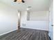 Second floor loft featuring wood flooring, a door and views to other rooms at 3975 Silverstream Ter, Sanford, FL 32771