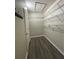 Spacious walk-in closet with wire shelving for storage and wood-look floors at 3975 Silverstream Ter, Sanford, FL 32771