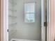Spacious walk-in closet with wire shelving and a window for natural light at 3975 Silverstream Ter, Sanford, FL 32771
