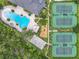 Aerial view of the pool, tennis courts, and playground, complemented by lush greenery and landscaping at 4334 Tolkien St, Orlando, FL 32828