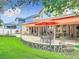 Lush backyard showcasing outdoor dining, lounge areas, and beautiful landscaping at 4334 Tolkien St, Orlando, FL 32828