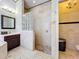 Elegant bathroom featuring a glass block shower, stylish fixtures, and beautiful tile flooring at 4334 Tolkien St, Orlando, FL 32828