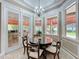 Charming breakfast nook with bright windows overlooking the outdoor patio at 4334 Tolkien St, Orlando, FL 32828