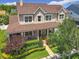 Beautiful two-story home highlighting the manicured front lawn, lush landscaping, and welcoming facade at 4334 Tolkien St, Orlando, FL 32828