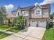 Charming two-story home with a well-manicured lawn, mature trees, and a spacious two-car garage at 4334 Tolkien St, Orlando, FL 32828