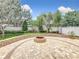 Backyard fire pit with manicured lawn and landscaping at 4334 Tolkien St, Orlando, FL 32828
