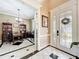 Inviting foyer leading to an office space with glass paned door and tile floors at 4334 Tolkien St, Orlando, FL 32828