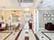 Elegant hallway featuring decorative tile flooring, arched doorways, and stylish decor at 4334 Tolkien St, Orlando, FL 32828