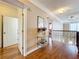 Second-floor hallway featuring hardwood flooring, trim work, and access to other rooms at 4334 Tolkien St, Orlando, FL 32828