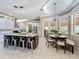 Spacious kitchen featuring a large island, stainless steel appliances, and adjacent breakfast nook at 4334 Tolkien St, Orlando, FL 32828