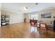 Spacious living room featuring hardwood floors, neutral walls, crown molding, and a large window at 4334 Tolkien St, Orlando, FL 32828