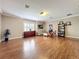 Spacious living room with hardwood floors, bright window and stylish decor at 4334 Tolkien St, Orlando, FL 32828