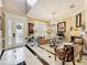 Bright living room with a decorative fireplace, large windows, and patterned tile flooring at 4334 Tolkien St, Orlando, FL 32828